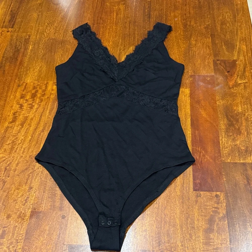 H&M Sexy Black Lace Trim Bodysuit size 8 fits like an M